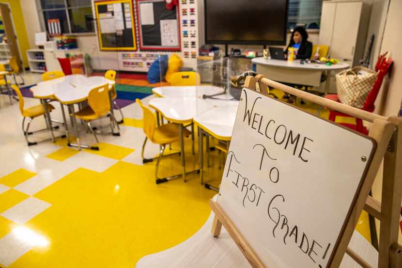 First grade teacher Shontee Brandon sits in an empty classroom as she prepares to teach...