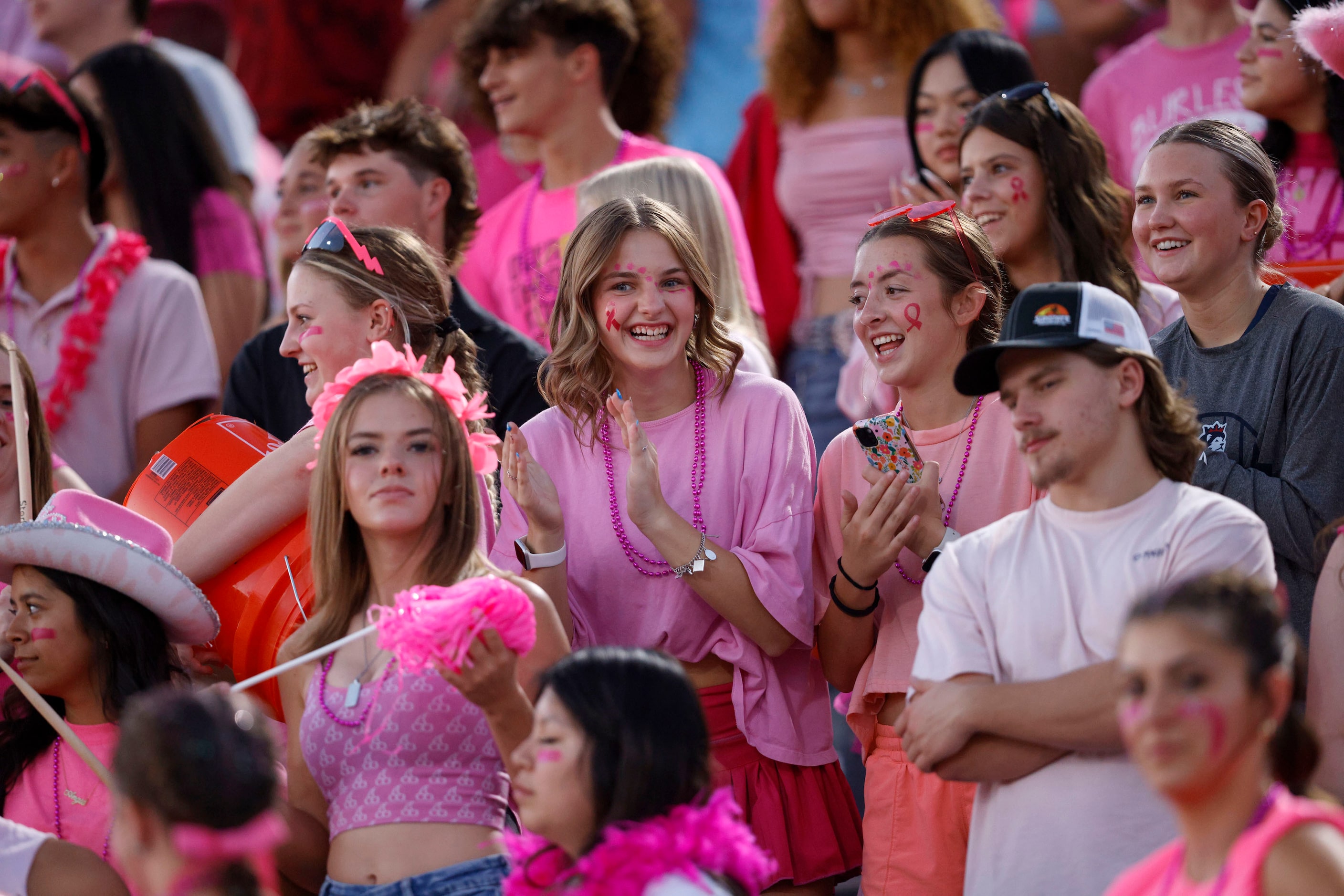 Richland fans cheer in the first half of a high school football game against Fossil Ridge at...