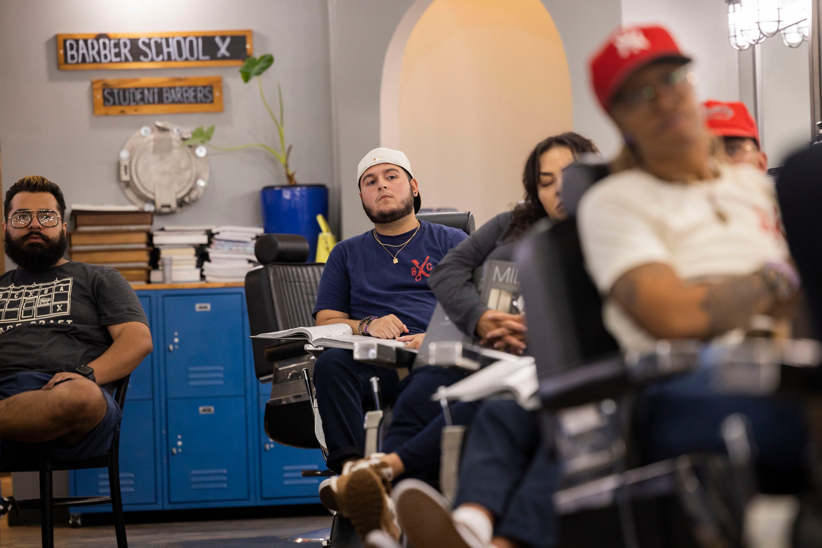 Jacob Acevedo listens during class at the Blade Craft Barber Academy in the Deep Ellum...