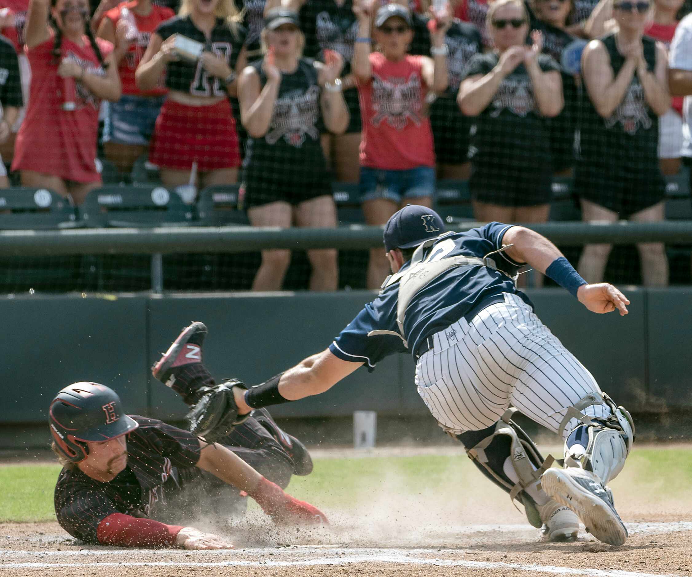 Rockwall-Heath Karson Krowka, (5), slides under the tag by Keller Colin Liles, (12), during...