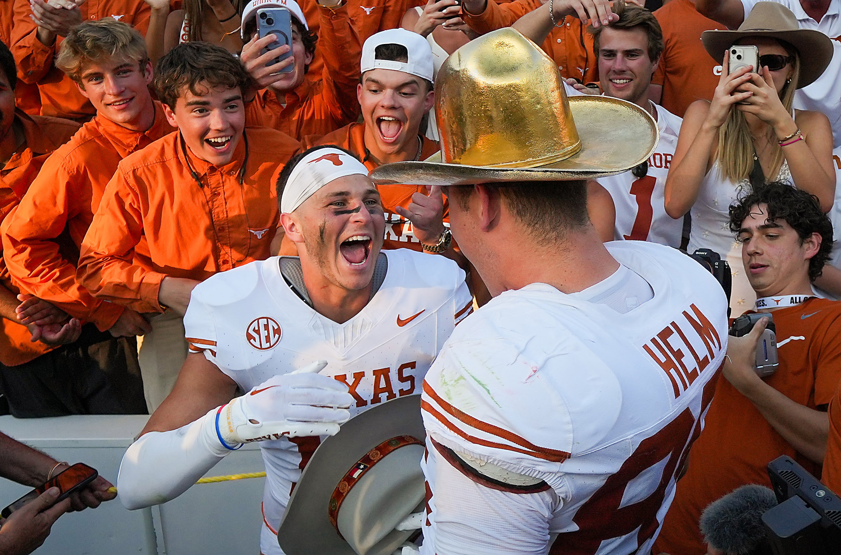 Texas defensive back Michael Taaffe (16) celebrates with tight end Gunnar Helm (85) after a...