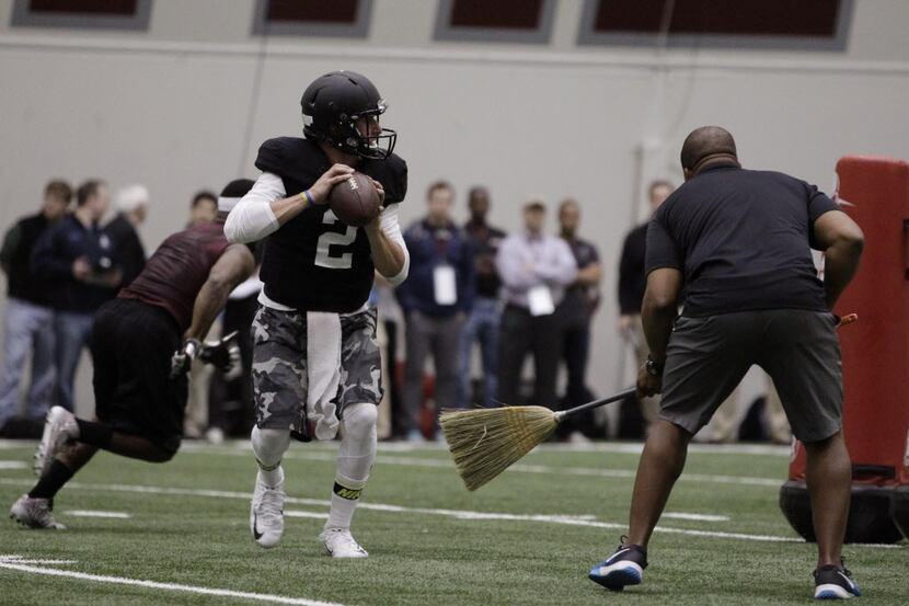 Texas A&M quarterback Johnny Manziel passes the ball during a drill at pro day for NFL...