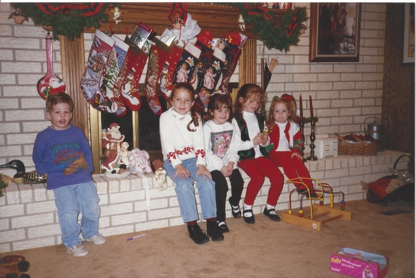 Nanette Light (second from left), then age 7, sits with her sisters and cousins (from left...