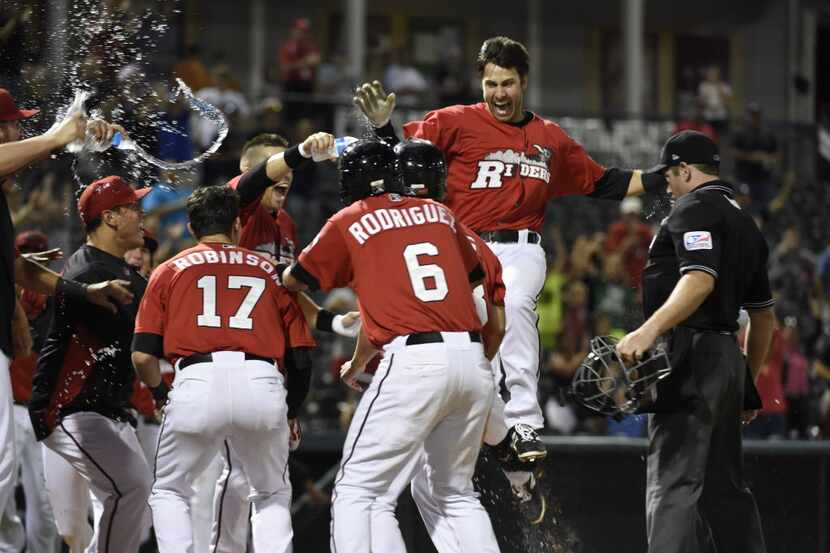 Third baseman Joey Gallo celebrates his three-run home run to win against the Midland...