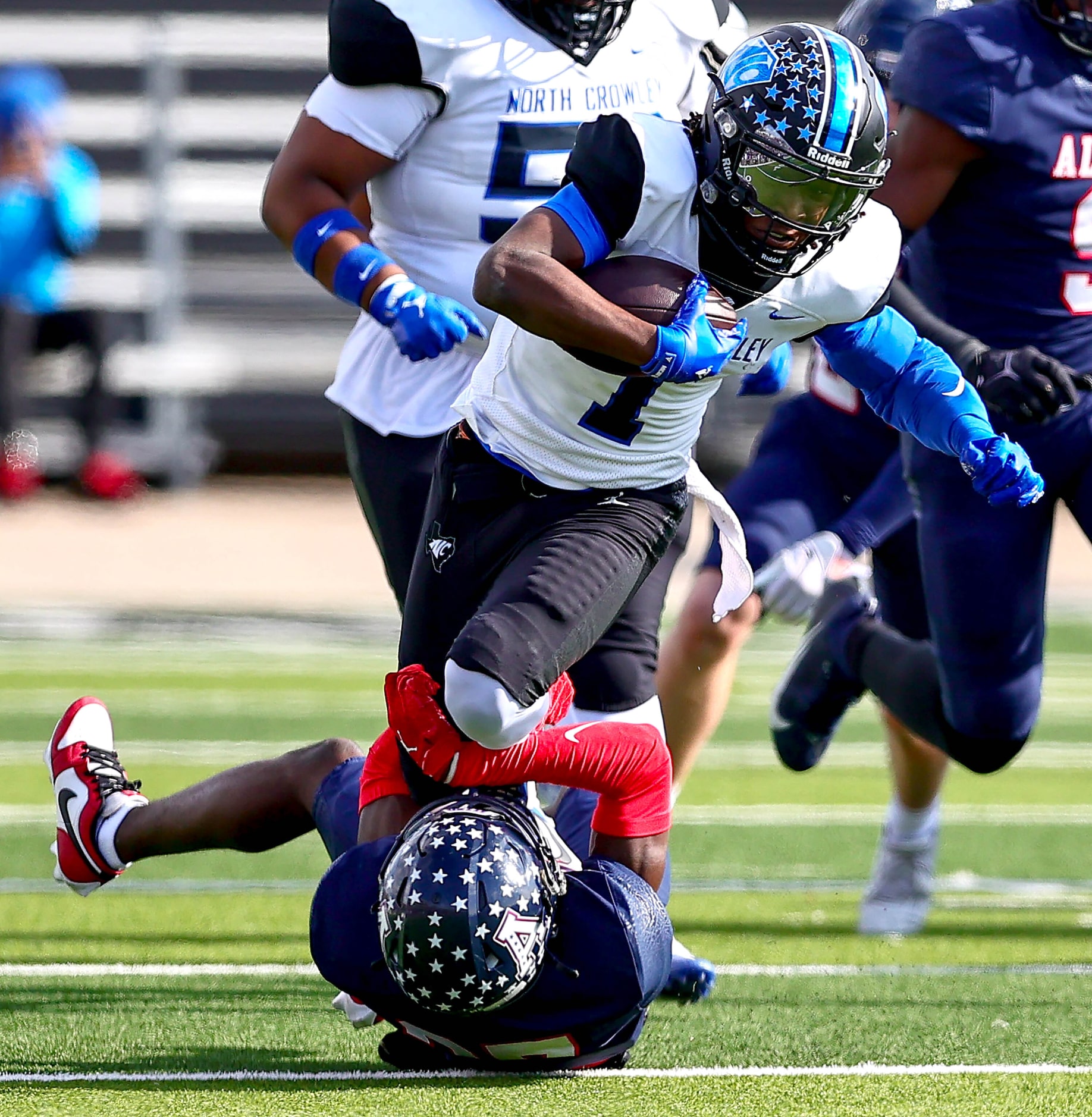 North Crowley running back Cornelius Warren III (1) tries to run over Allen defensive back...