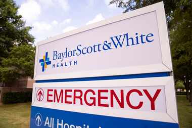 A sign for Baylor Scott & White Health on June 29, 2021, in Dallas.