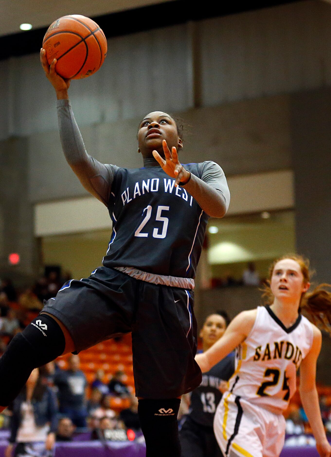 Plano West guard Sydney Skinner (25) makes an easy layup against Amarillo in the second half...