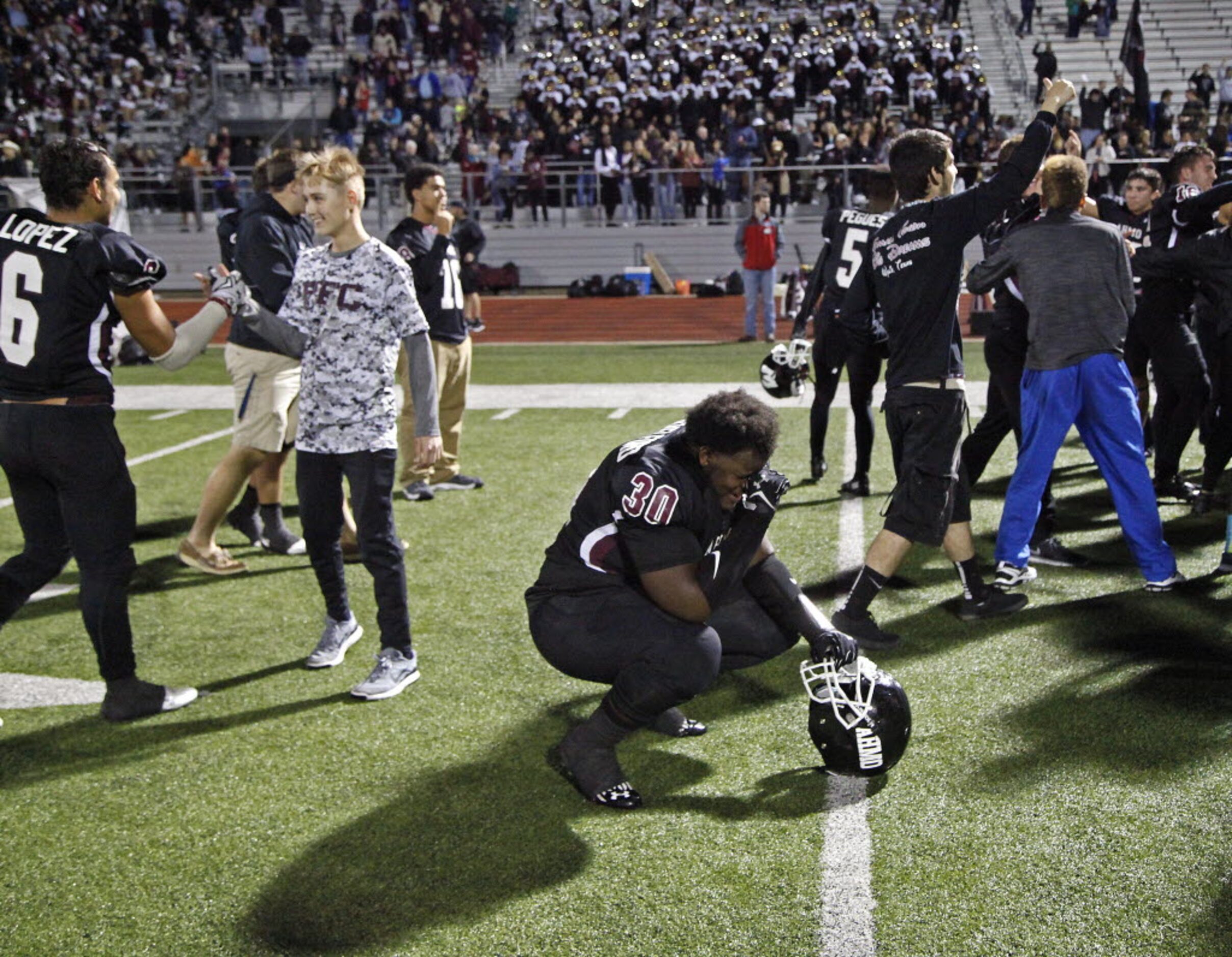 Wylie High School defensive lineman Jeramyah Shackelford (30) collects his emotions after...