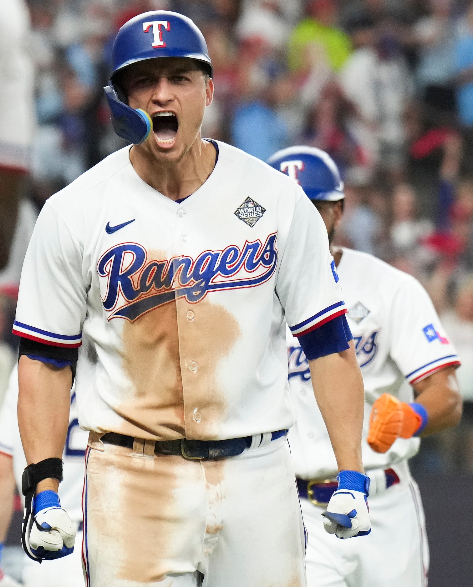 Texas Rangers' Corey Seager celebrates after hitting a two-run home run to tie the game...