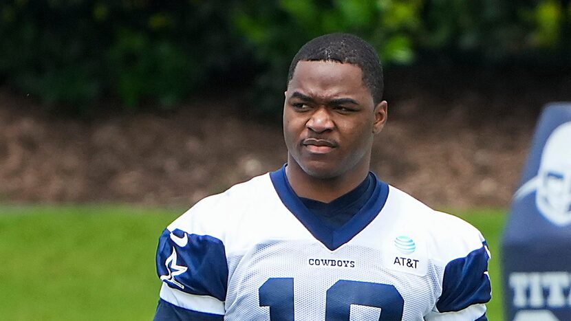 Dallas Cowboys wide receiver Amari Cooper watches his teammates run drills during a minicamp...