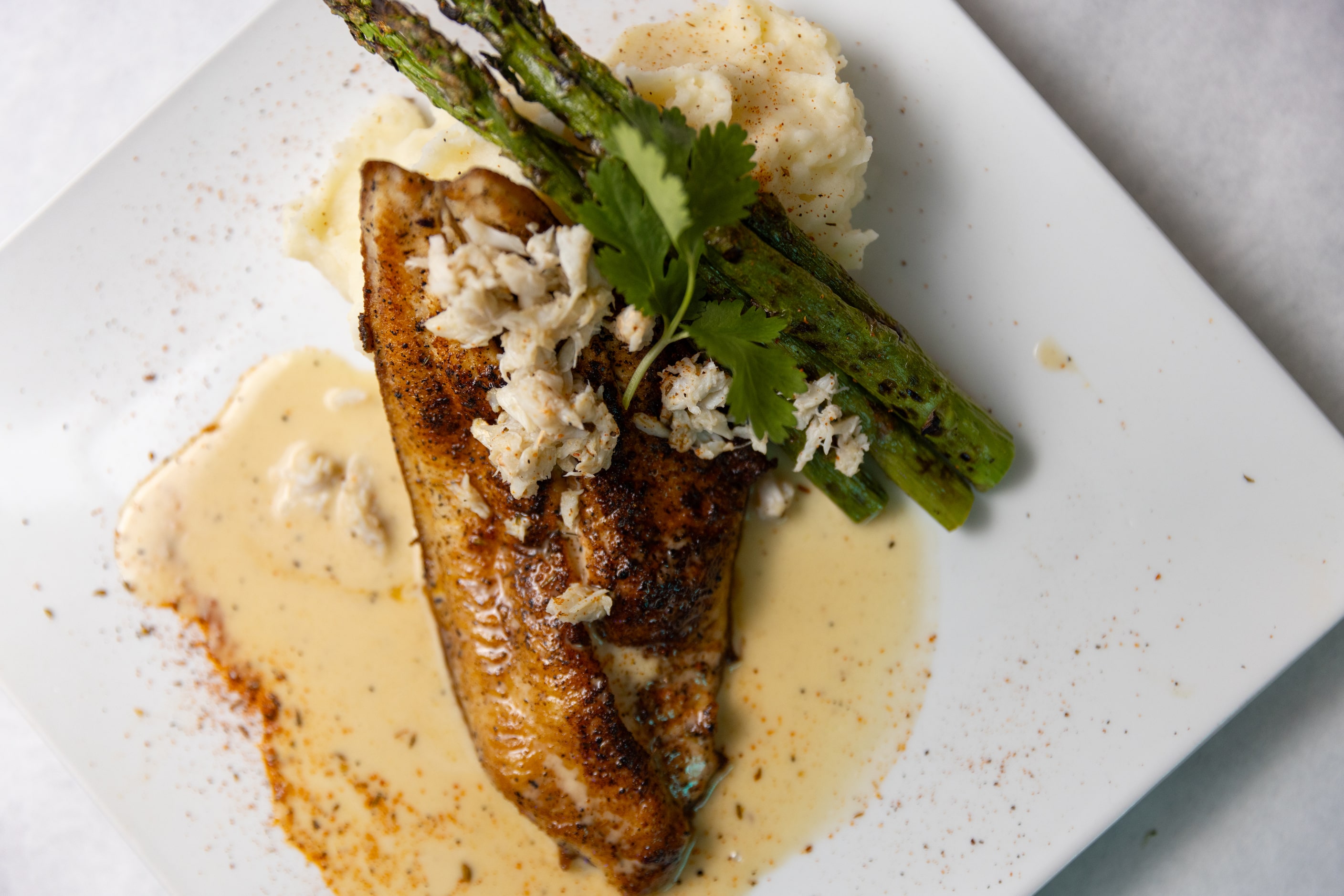  Blackened catshish and crab with lemon butter sauce, asparagus and garlic mash is available...