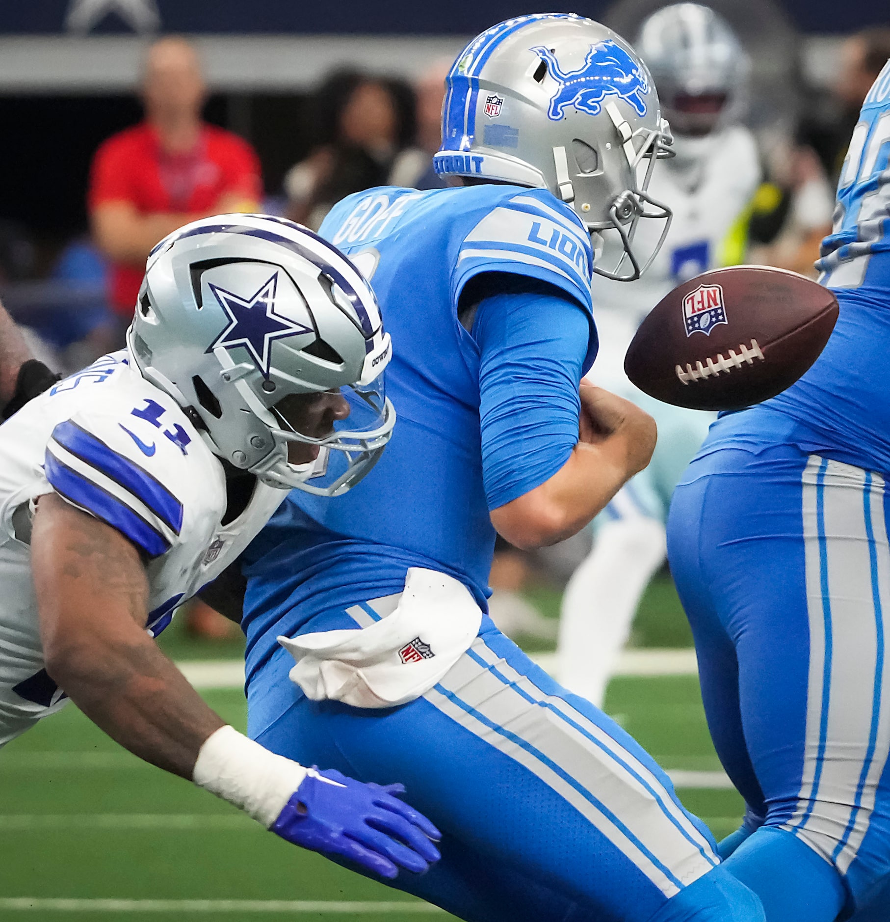 Detroit Lions quarterback Jared Goff (16) fumbles as he is sacked by Dallas Cowboys...