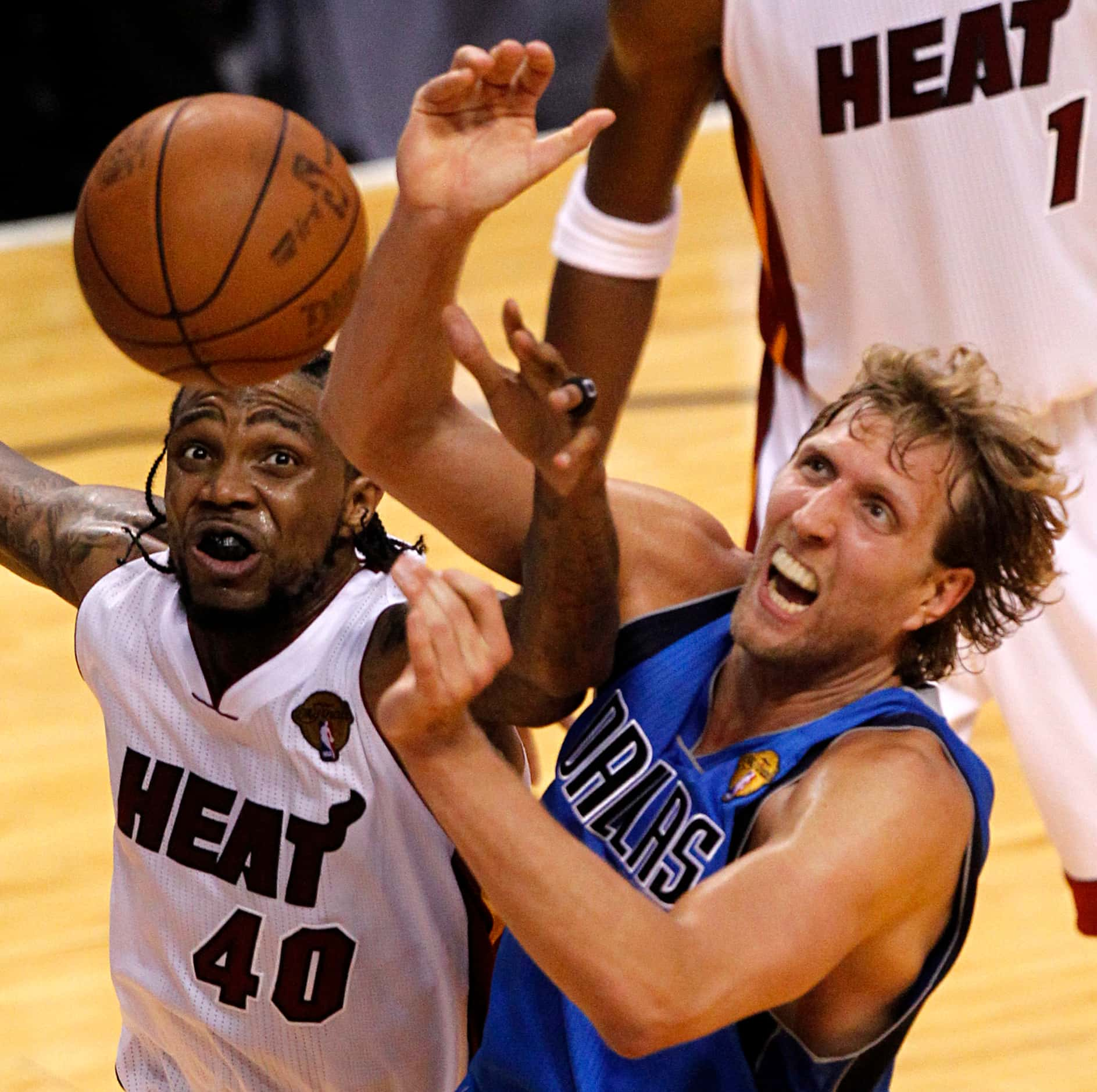 Dallas Mavericks power forward Dirk Nowitzki (41) and Miami Heat power forward Udonis Haslem...