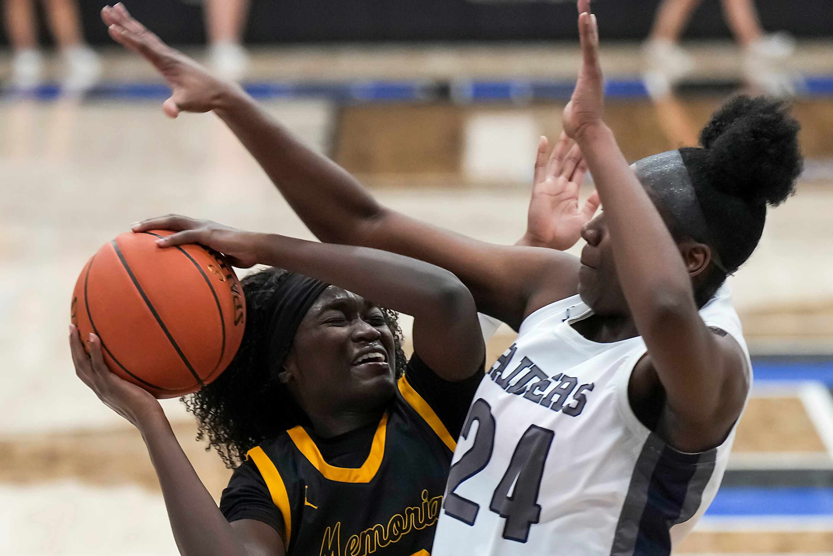 Frisco Memorial's Jasmyn Lott (10) is fouled by Wylie East's LeAire Nicks (24) during the...