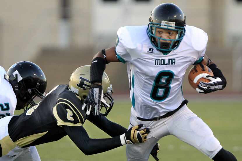 Dallas Molina High WR Lynden Edwards (8) picks up a couple of yards, but is finally stopped...