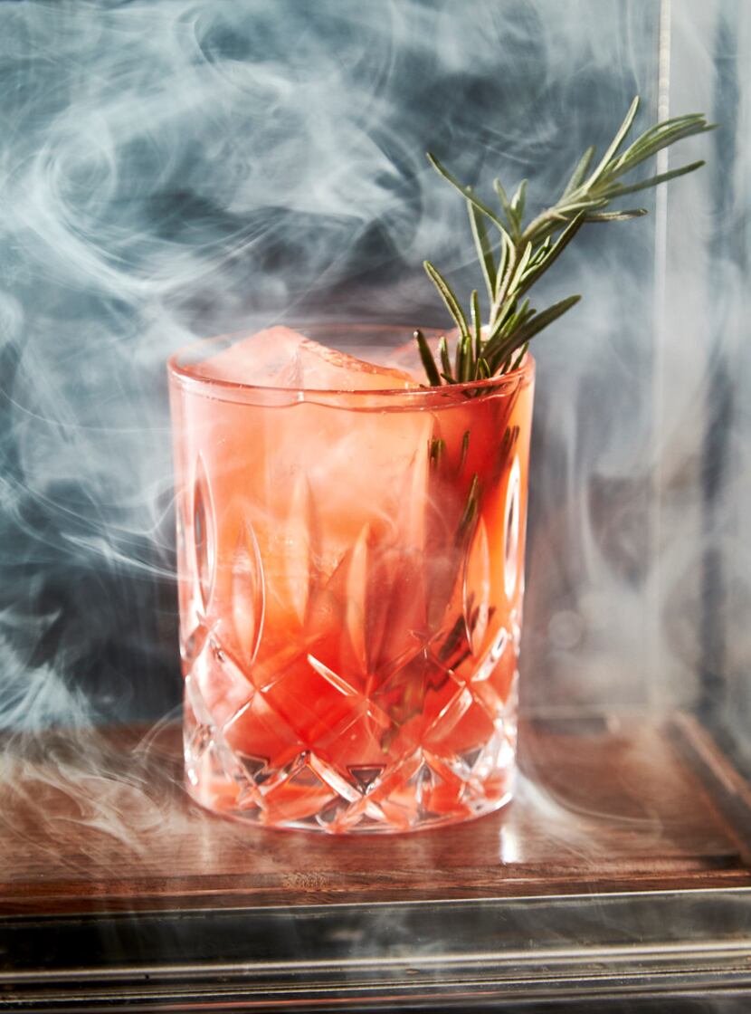 A "Smoke and Rosemary" at Beau Nash cocktail bar at Hotel Crescent in Dallas