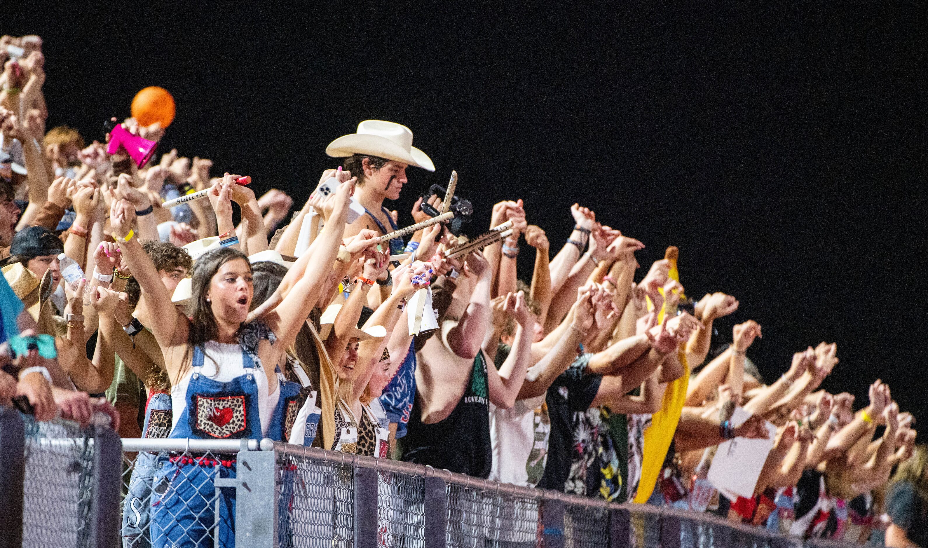 Lovejoy students cheer before a kickoff in the first half during a high school football game...