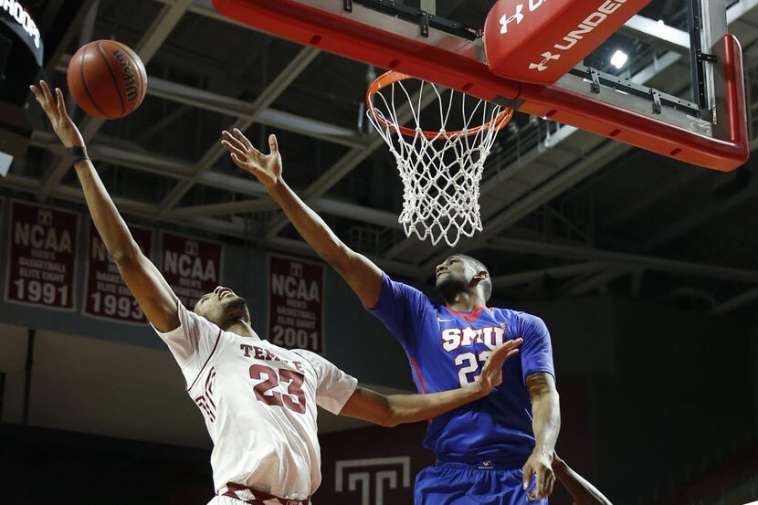 Temple's Devontae Watson, left, pulls in a rebound against SMU's Jordan Tolbert during the...