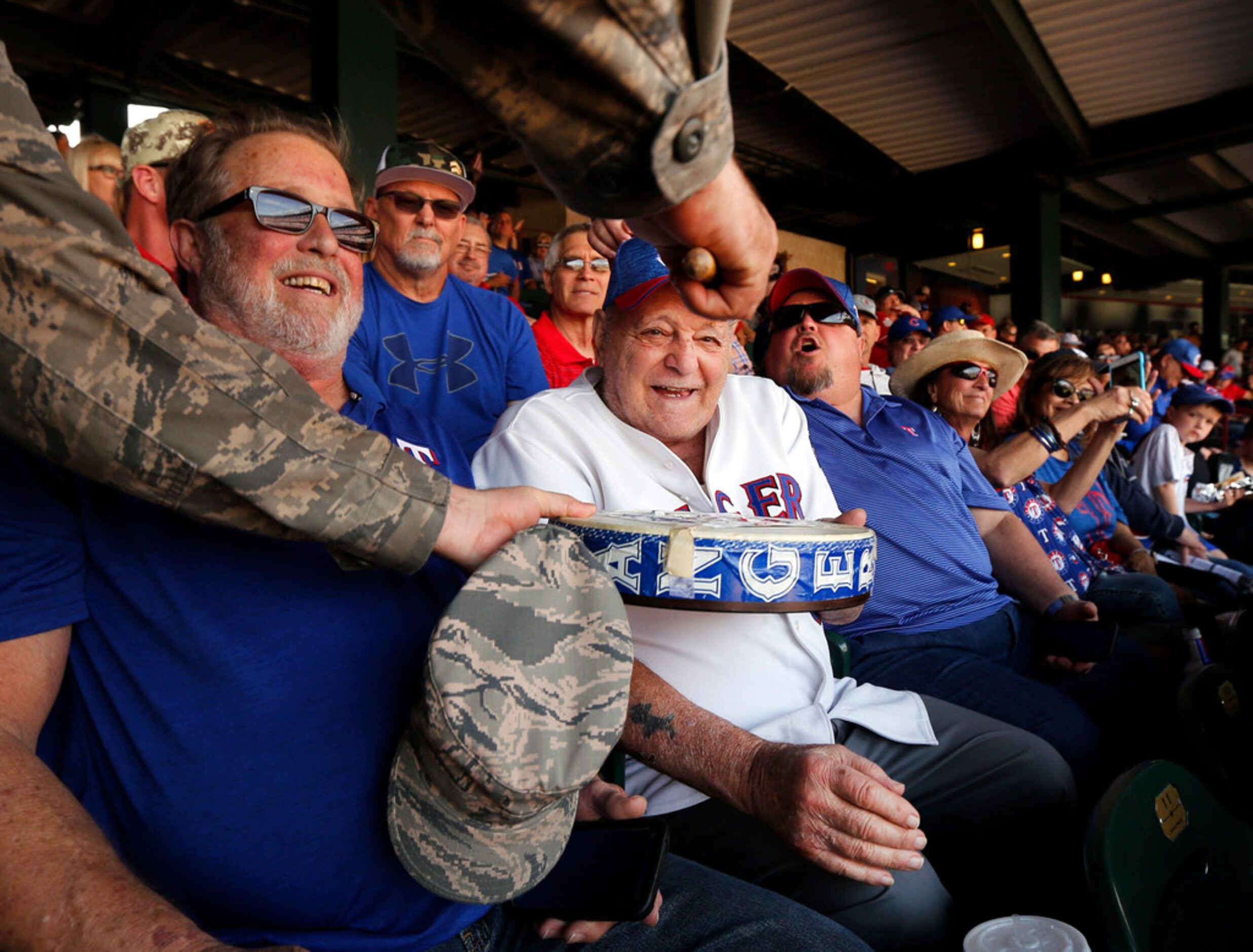 Zonk aka John Lanzillo Jr., 85, handed his drum to Master Sgt. Randy Loyer to play on during...