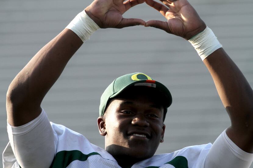DeSoto running back Dontre Wilson (2) is happy as he announces his plans to attend and play...