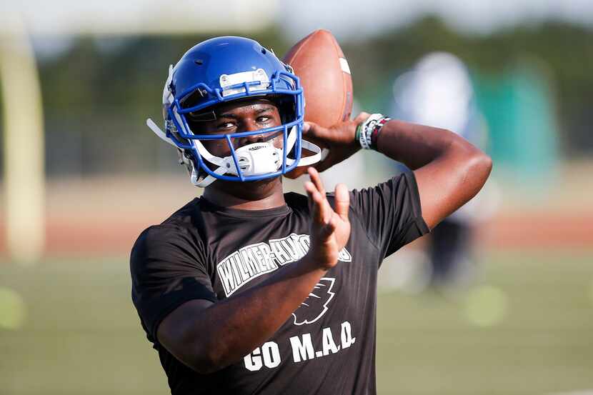 Wilmer-Hutchins senior quarterback Kyle Douglas participates in a drill during the first...