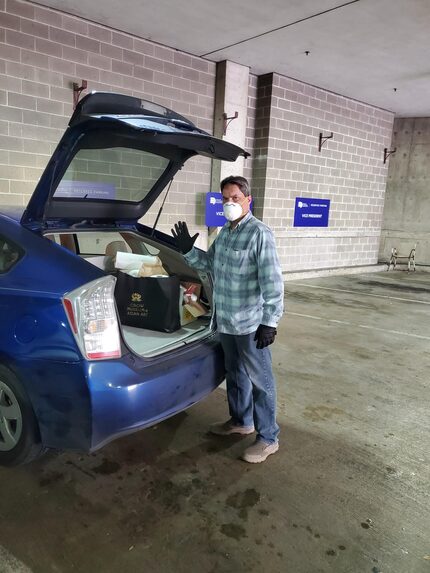 Violinist Bruce Patti delivers groceries as part of the Dallas Symphony Orchestra's...