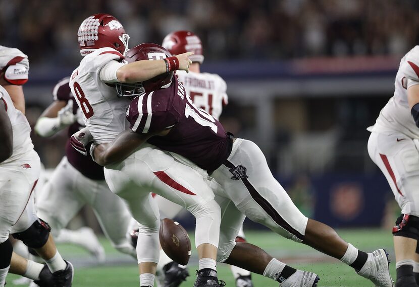 ARLINGTON, TX - SEPTEMBER 24:  Austin Allen #8 of the Arkansas Razorbacks fumbles the ball...