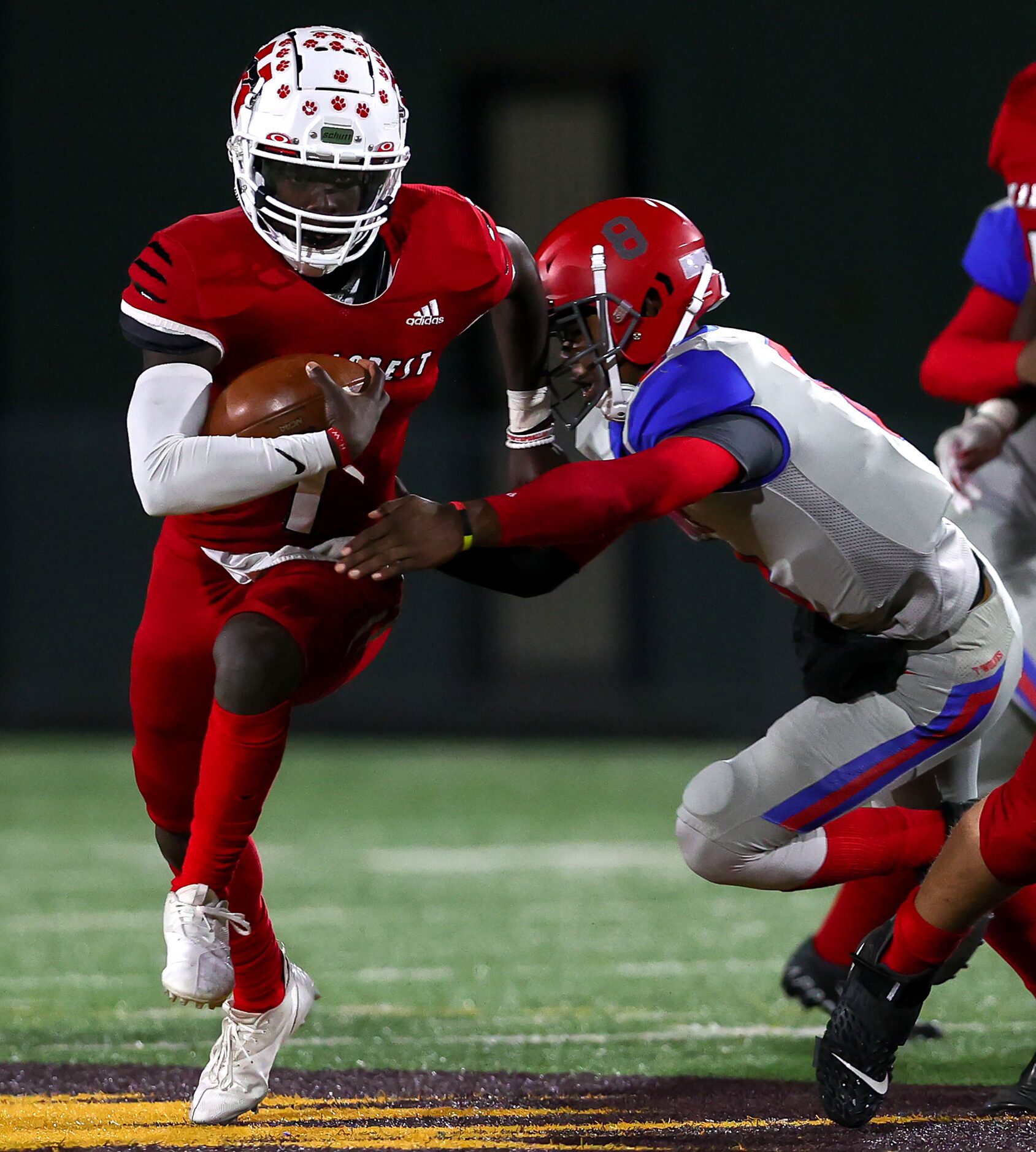 Hillcrest quarterbak Carter Sido (1) gets past Spruce linebacker Kelvin Jones (8) for a nice...