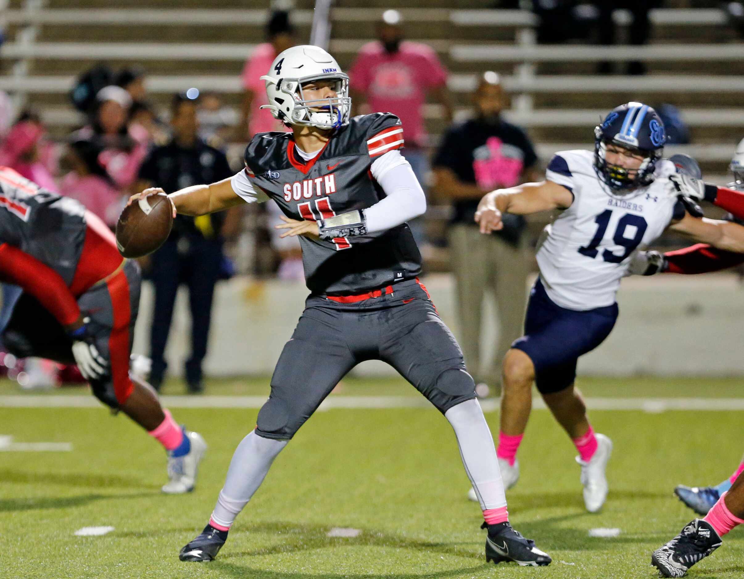 South Garland High QB Mirko Martos (4) throws under pressure during the first half of a high...