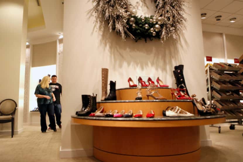 Brandi (left) and Jesse Espinoza shopped for shoes at Neiman Marcus in NorthPark Center last...