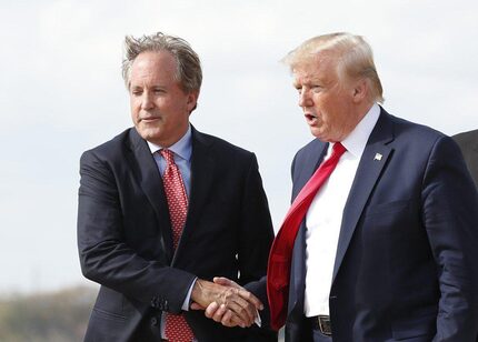 Texas Attorney General Ken Paxton  greets President Donald Trump at Austin Bergstrom...