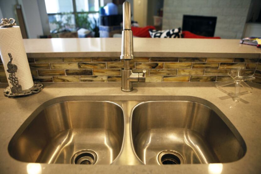 The kitchen's backsplash tile from Walker Zanger is made of recycled glass. Kitchen...