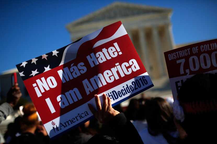 WASHINGTON, DC - NOVEMBER 20:  Supporters of immigration reform protest outside the U.S....
