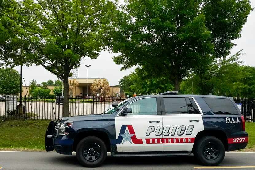 An Arlington police vehicle passes drives down Mansfield Road photographed on Thursday,...