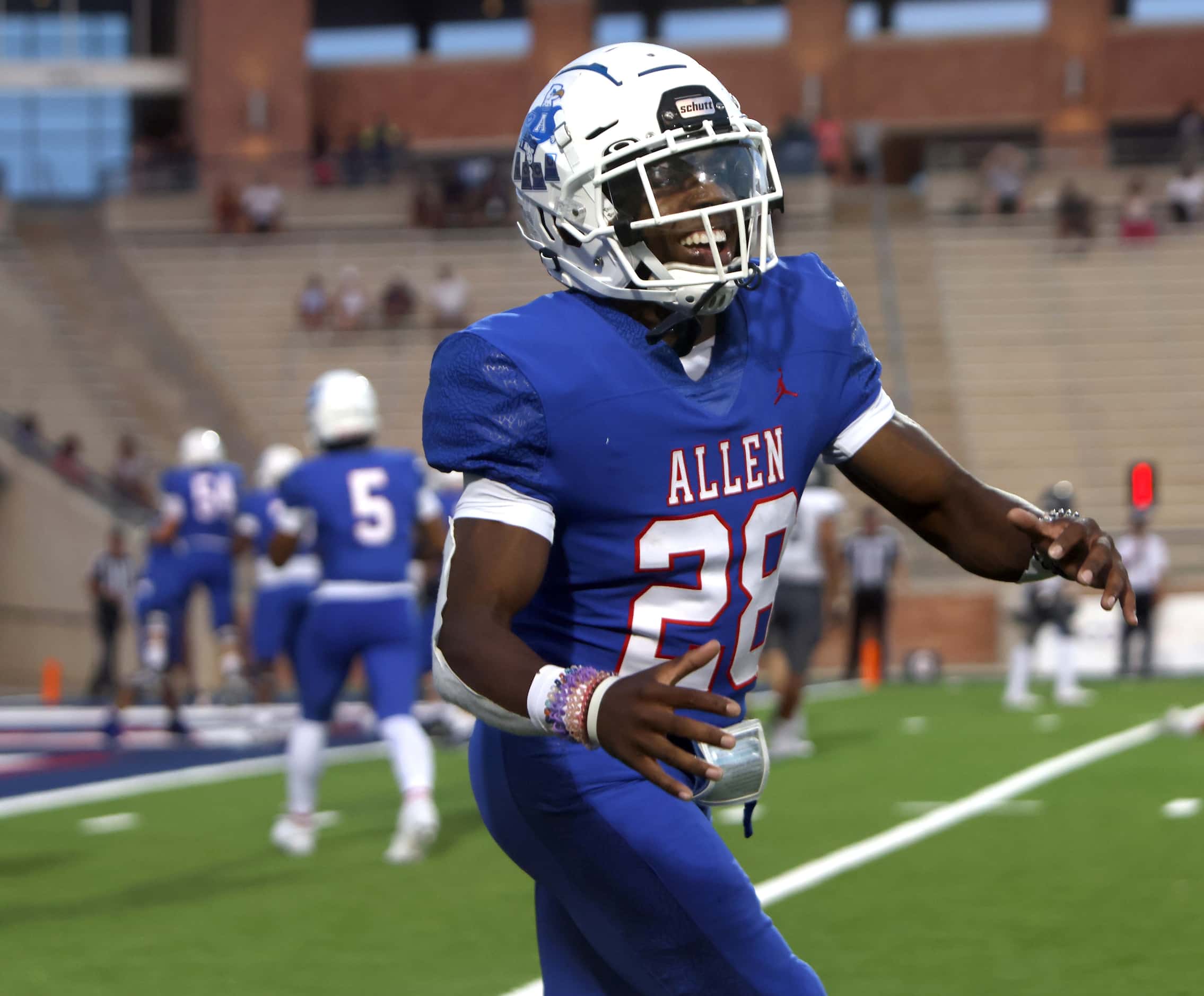 Allen running back Amir McDowell (28) was all smiles as he returned to the team bench after...