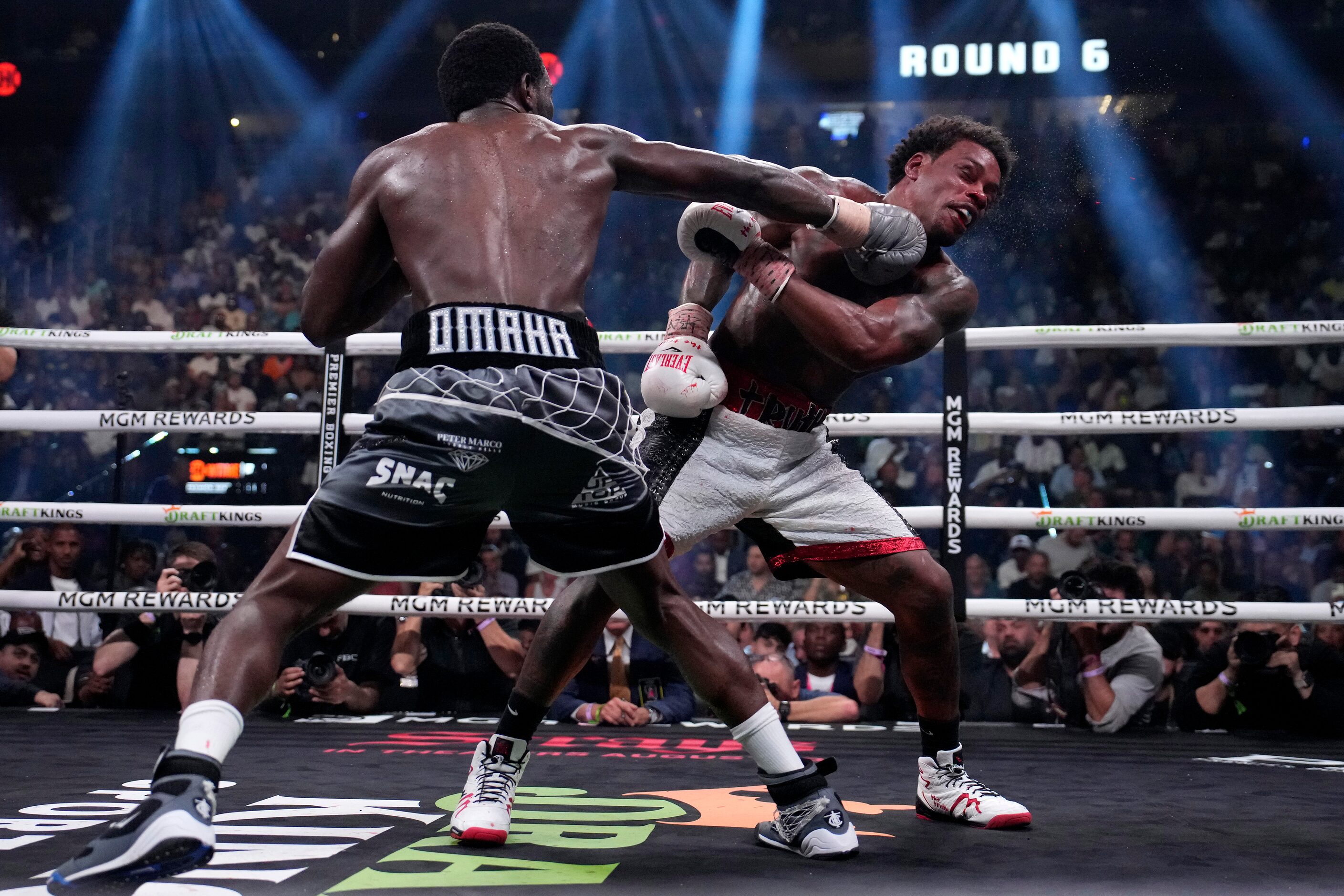 Terence Crawford, left, and Errol Spence Jr. fight during their undisputed welterweight...