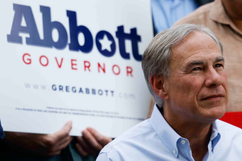 Texas Governor Greg Abbott takes questions from the members of the media as he campaigns in...