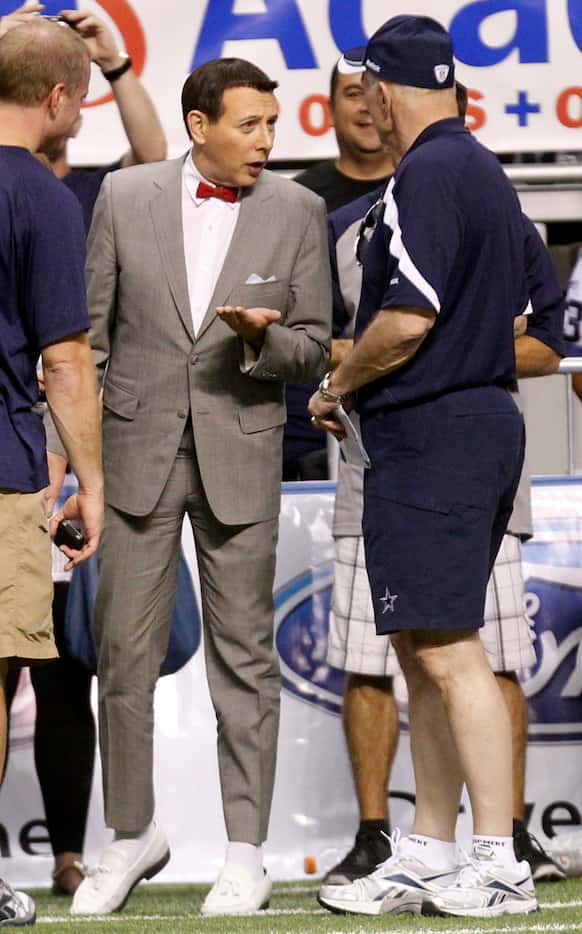 Dallas Cowboys owner Jerry Jones talks to entertainer Pee-wee Herman (Paul Reubens) during...