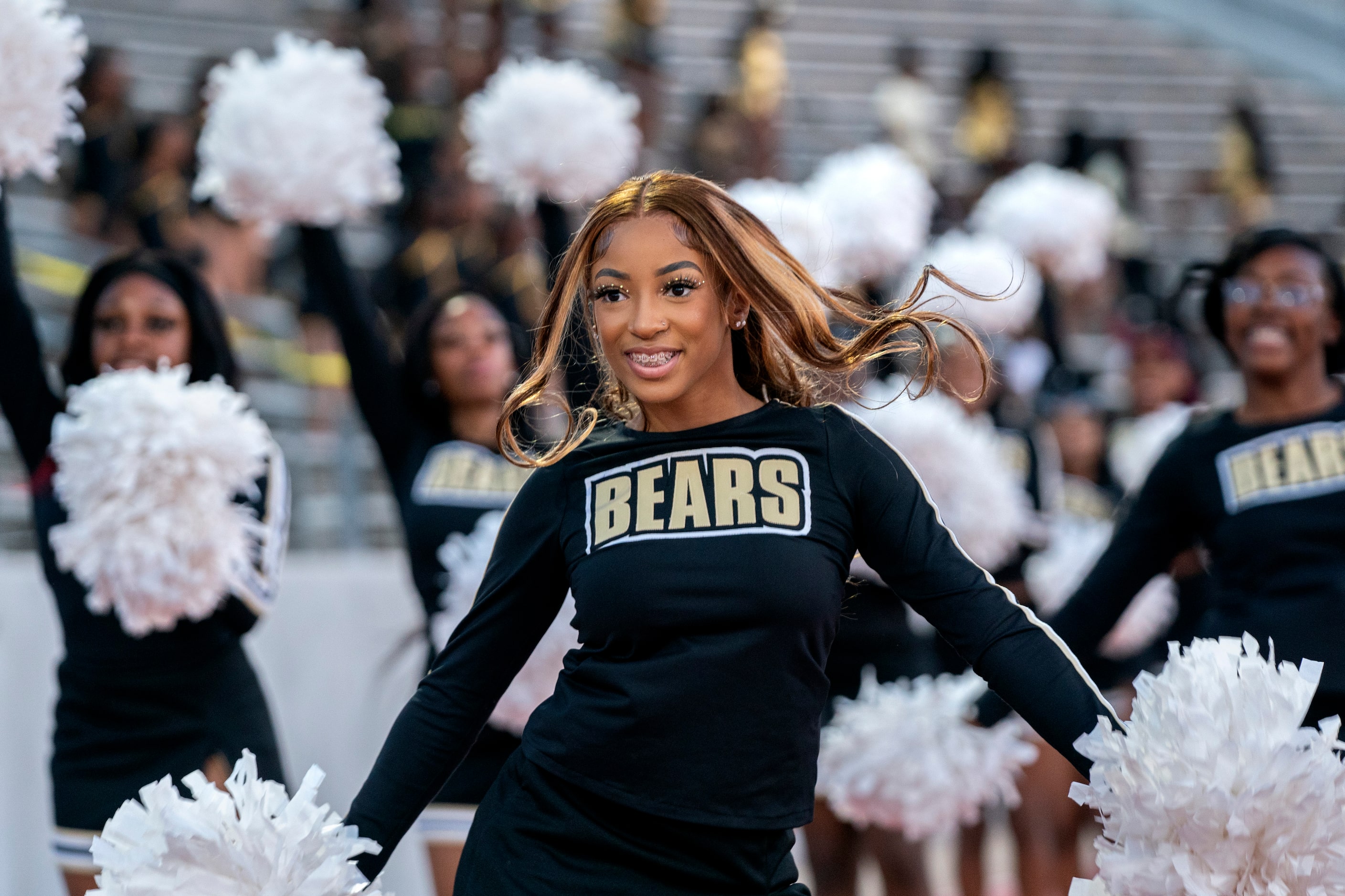 South Oak Cliff senior cheerleader Shaneice Biggers enters the stadium before a high school...