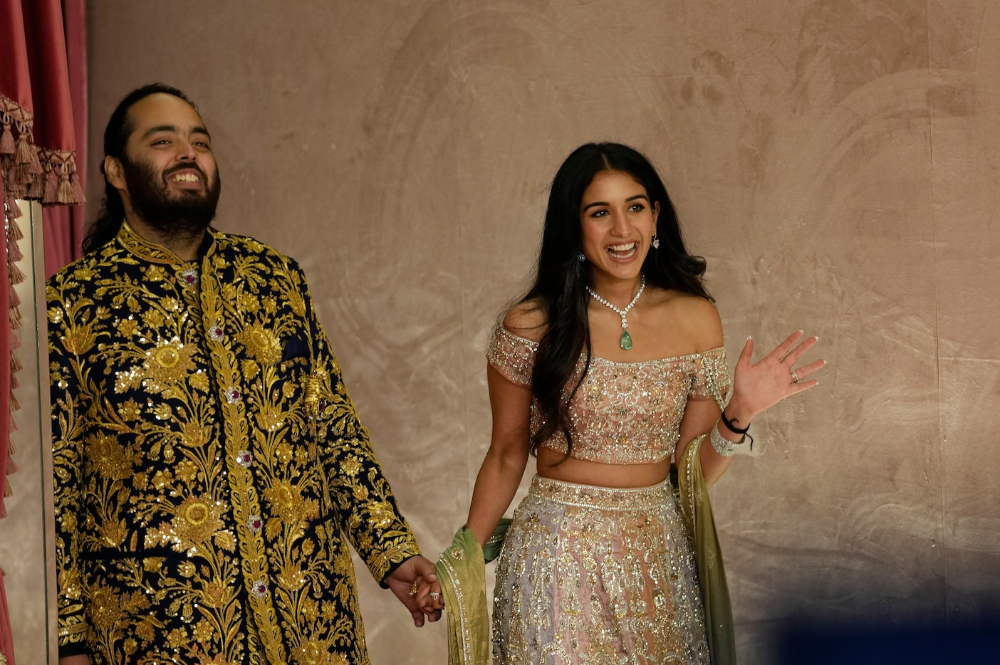 Anant Ambani, left, and Radhika Merchant  during their pre-wedding ceremony in Mumbai,...