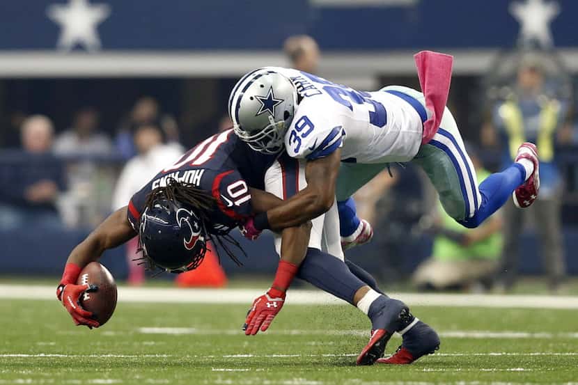 Dallas Cowboys cornerback Brandon Carr (39) tackles Houston Texans wide receiver DeAndre...