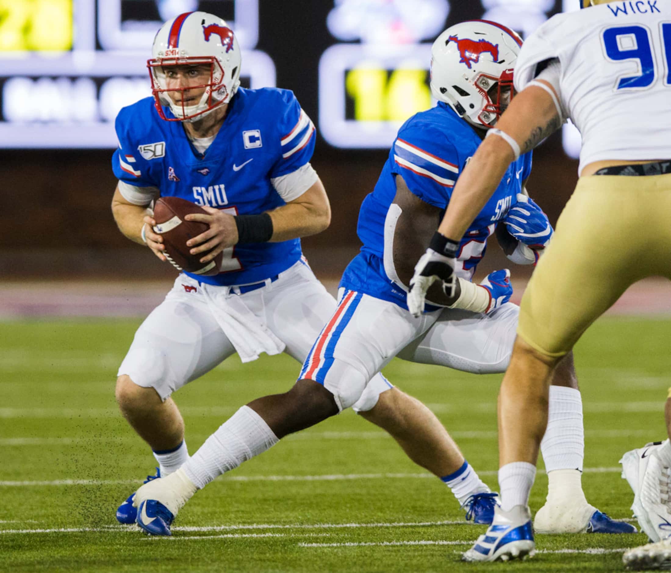 SMU Mustangs quarterback Shane Buechele (7) looks for a receiver during the second quarter...