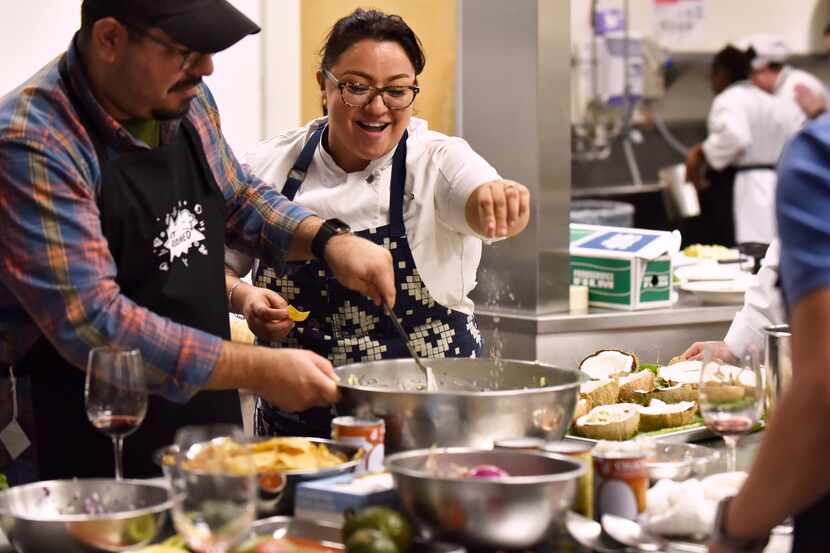 Chef Anastacia Quiñones-Pittman, center, instructs Joe Felan as she adds salt to a ceviche...