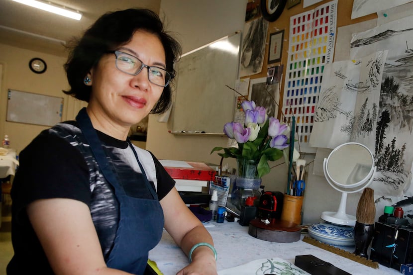 Artist Jenney Chang poses for a photo in her Plano home studio on Aug. 11, 2019. Chang has...