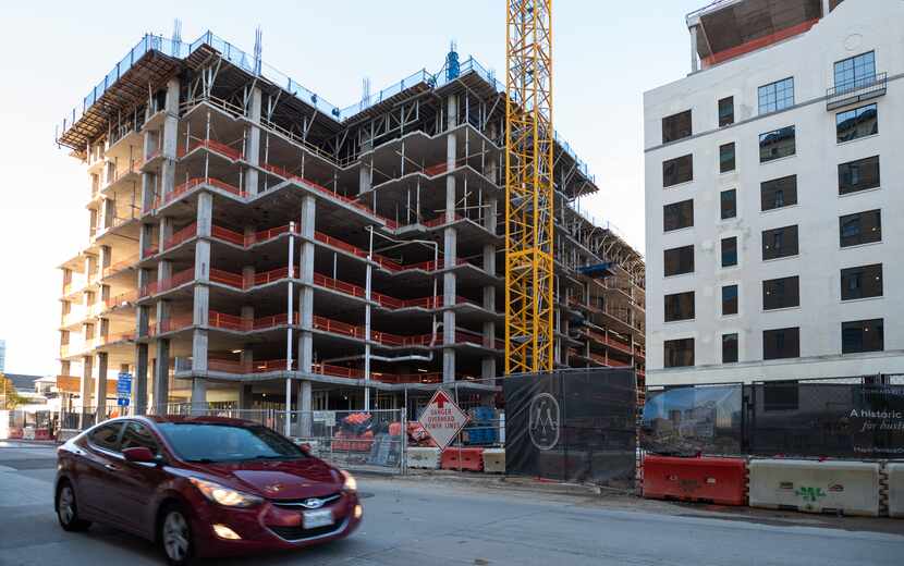 A 21-story apartment tower is being built behind the landmark Maple Terrace building on Wolf...