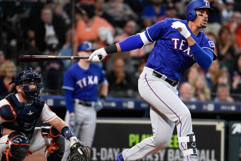 Texas Rangers' Ronald Guzman hits a game-tying home run off Houston Astros relief pitcher...