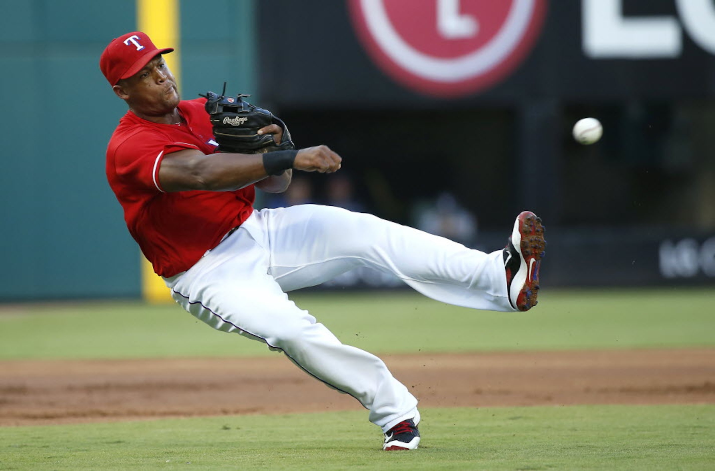 Texas Rangers third baseman Adrian Beltre (29) throws the ball to first during the first...