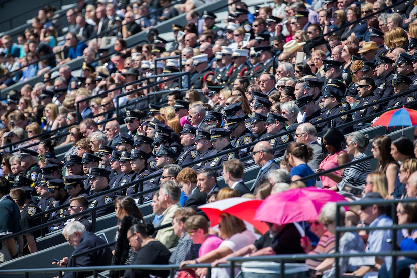  Hundreds of police officers sit in the stands during a memorial service for Euless police...