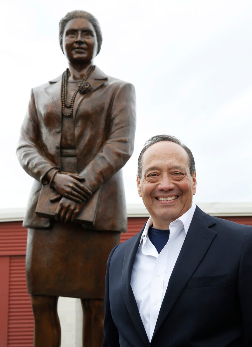 JD Gonzales poses for a portrait next to a statue of Adelfa B. Callejo statue by artist...