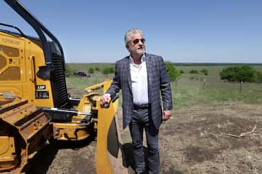 Mehrdad Moayedi poses for a photograph during a groundbreaking ceremony at the new Centurion...